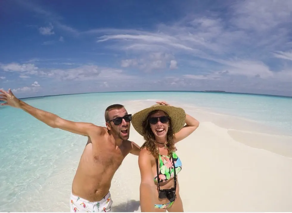 Budget Travel in the Maldives - Lauren and Craig on a white sand beach 